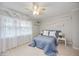 Bedroom with neutral walls, tan tile floor, shelving, and decorative trim at 10308 Kingfisher W Rd, Bradenton, FL 34209