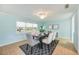 Inviting dining room with a large window and modern decor, adjacent to other living spaces at 10308 Kingfisher W Rd, Bradenton, FL 34209