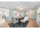 Elegant dining room with stylish furniture and a view into the living spaces at 10308 Kingfisher W Rd, Bradenton, FL 34209