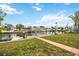 Wide shot of a wooden dock and walkway overlooking the canal and homes at 10308 Kingfisher W Rd, Bradenton, FL 34209