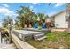 Dockside view of chairs and palm trees, an excellent place to relax and enjoy the view at 10308 Kingfisher W Rd, Bradenton, FL 34209