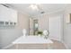 Home office with neutral walls, tan tile floor, bright window and built-in storage at 10308 Kingfisher W Rd, Bradenton, FL 34209