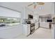 Bright kitchen featuring white cabinets, stainless steel appliances, and a view of the canal at 10308 Kingfisher W Rd, Bradenton, FL 34209