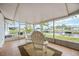 Screened-in lanai with tiled floor overlooking the canal at 10308 Kingfisher W Rd, Bradenton, FL 34209