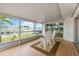 Screened-in lanai with tiled floor overlooking the canal at 10308 Kingfisher W Rd, Bradenton, FL 34209