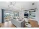 Bright and airy living room with water views and a sliding glass door to the outside patio at 10308 Kingfisher W Rd, Bradenton, FL 34209