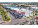 Overhead shot of a picturesque street featuring unique businesses and lovely palm trees, giving a lively and inviting feel at 1156 Lemon Bay Dr, Venice, FL 34293