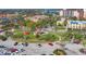Aerial view of a well maintained park, with a gazebo, and parking with several cars at 1156 Lemon Bay Dr, Venice, FL 34293