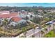 Beautiful aerial view of a commercial building featuring a unique clock tower and well-maintained landscaping at 1156 Lemon Bay Dr, Venice, FL 34293