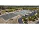 Birds eye view of tennis and basketball courts and a parking lot adjacent to Lemon Bay in Venice, Florida at 1156 Lemon Bay Dr, Venice, FL 34293