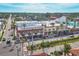 A charming street with a variety of attractive businesses and lush palm trees, creating a lively and inviting atmosphere at 1156 Lemon Bay Dr, Venice, FL 34293