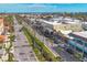 Overhead view of a vibrant street featuring charming businesses and tall palm trees, creating a lively and inviting atmosphere at 1156 Lemon Bay Dr, Venice, FL 34293