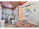 This bathroom features a vessel sink with granite countertops and a glass enclosed shower at 1156 Lemon Bay Dr, Venice, FL 34293