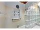 Bathroom with a built in shelf and a glass block partition at 1156 Lemon Bay Dr, Venice, FL 34293