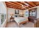 Bedroom with exposed wood beams, a ceiling fan, and lots of natural light at 1156 Lemon Bay Dr, Venice, FL 34293