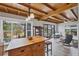 Open breakfast area features a wood countertop island and view to the backyard at 1156 Lemon Bay Dr, Venice, FL 34293