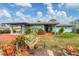 Attractive home with a colorful garden, and convenient carport at 1156 Lemon Bay Dr, Venice, FL 34293