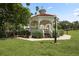 Charming park gazebo with benches surrounded by manicured landscaping under a bright sunny sky at 1156 Lemon Bay Dr, Venice, FL 34293