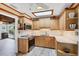 Well-lit kitchen features wooden cabinets, countertops, and modern appliances at 1156 Lemon Bay Dr, Venice, FL 34293