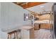 Bright kitchen with white brick wall, breakfast bar, modern appliances, and stylish decor at 1156 Lemon Bay Dr, Venice, FL 34293