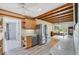Bright kitchen features modern appliances, wooden cabinets, and backyard access at 1156 Lemon Bay Dr, Venice, FL 34293
