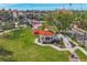Scenic view of a gazebo on a green lawn featuring a walkway, benches, and landscaping at 1156 Lemon Bay Dr, Venice, FL 34293