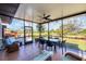 Inviting screened patio with dining table and seating, perfect for enjoying the outdoors at 1156 Lemon Bay Dr, Venice, FL 34293