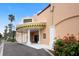 The Venice Theatre entrance showcases a classic facade with columns, an awning, and landscaping at 1156 Lemon Bay Dr, Venice, FL 34293