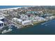 Aerial view showcasing waterfront condos, a marina, and residential community with boat access at 1280 Dolphin Bay Way # 503, Sarasota, FL 34242