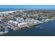 Expansive aerial of waterfront condos, marina, and community with easy beach access and boating amenities at 1280 Dolphin Bay Way # 503, Sarasota, FL 34242