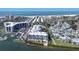 Aerial view of waterfront condos with boat docks and beach access at 1280 Dolphin Bay Way # 503, Sarasota, FL 34242