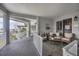 Inviting covered balcony with comfortable seating and tiled floor, perfect for relaxing outdoors at 1280 Dolphin Bay Way # 503, Sarasota, FL 34242