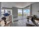 Spacious covered balcony with outdoor grill, seating, and views, great for entertaining at 1280 Dolphin Bay Way # 503, Sarasota, FL 34242