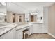 Bright bathroom featuring granite countertops, vanity with drawers, and a large mirror above at 1280 Dolphin Bay Way # 503, Sarasota, FL 34242
