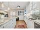 Well-lit kitchen featuring a breakfast bar and stainless steel appliances at 1280 Dolphin Bay Way # 503, Sarasota, FL 34242