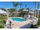 Community pool area with lounge chairs and well-maintained brick patio at 1280 Dolphin Bay Way # 503, Sarasota, FL 34242