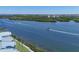 Scenic water view featuring boat traffic on a sunny day near lush mangroves at 1280 Dolphin Bay Way # 503, Sarasota, FL 34242