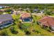 Expansive lawn surrounds this beautiful home with a screened-in pool within an attractive neighborhood at 12830 24Th Street E Cir, Parrish, FL 34219