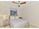 Bedroom featuring a full-size bed and a window for natural light at 12830 24Th Street E Cir, Parrish, FL 34219