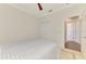 Bedroom featuring a full-size bed, a closet, and a view to the bathroom at 12830 24Th Street E Cir, Parrish, FL 34219