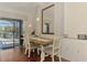 Well-lit dining area leading to a screened-in lanai and a serene outdoor space at 12830 24Th Street E Cir, Parrish, FL 34219
