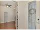 Elegant foyer with decorative glass door leading to an office space with hardwood floors at 12830 24Th Street E Cir, Parrish, FL 34219