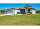 Well-maintained home with a manicured lawn, a two-car garage, and tasteful landscaping at 12830 24Th Street E Cir, Parrish, FL 34219