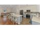 Open-concept kitchen and living area with granite countertops and stainless steel appliances at 12830 24Th Street E Cir, Parrish, FL 34219