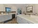 Well-lit kitchen showcases bright countertops, two-tone cabinets, and a stainless steel dishwasher at 12830 24Th Street E Cir, Parrish, FL 34219