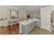 The kitchen features bright countertops and modern island, great for cooking and entertaining at 12830 24Th Street E Cir, Parrish, FL 34219