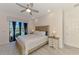 Sunlit primary bedroom features direct access to the pool area and light wood decor at 12830 24Th Street E Cir, Parrish, FL 34219