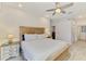 Relaxing primary bedroom showcases a king bed with light wood furniture and a peaceful ambiance at 12830 24Th Street E Cir, Parrish, FL 34219