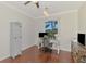 Office space featuring a desk, chair, dark wood flooring, and natural light at 12830 24Th Street E Cir, Parrish, FL 34219