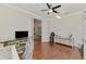 Office space featuring dark wood floors and an adjacent room at 12830 24Th Street E Cir, Parrish, FL 34219